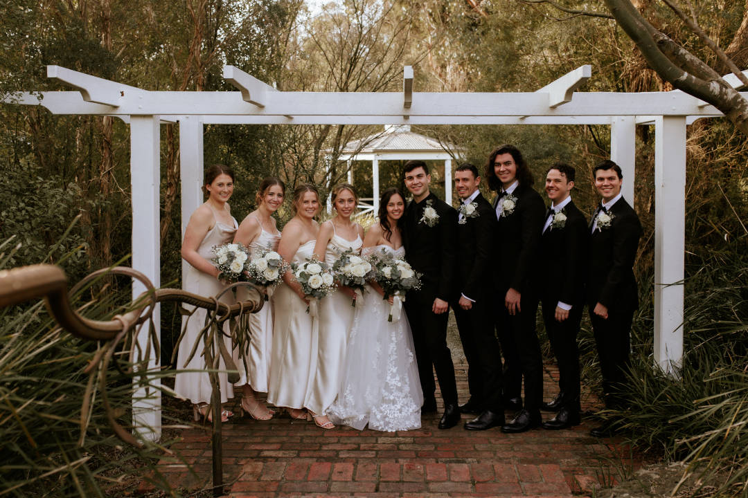 Potters Receptions MWB37_Potters Receptions_white pagola_wedding party_bride and groom_wedding flowers